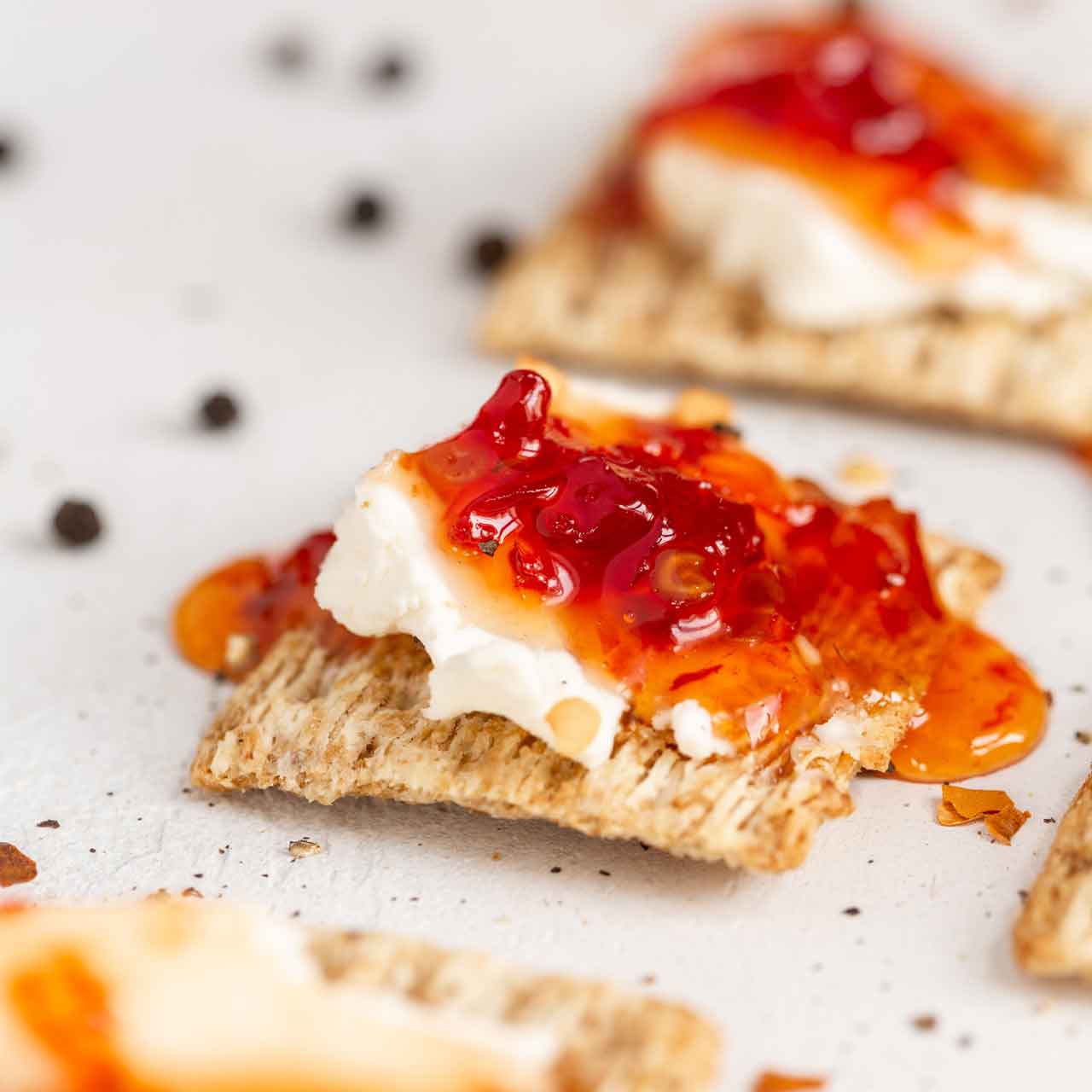 cracker with red pepper jelly